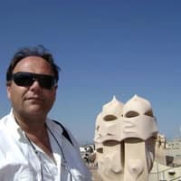 Boban Milivojević, founder of CAD ART studio, on a sunlit rooftop terrace