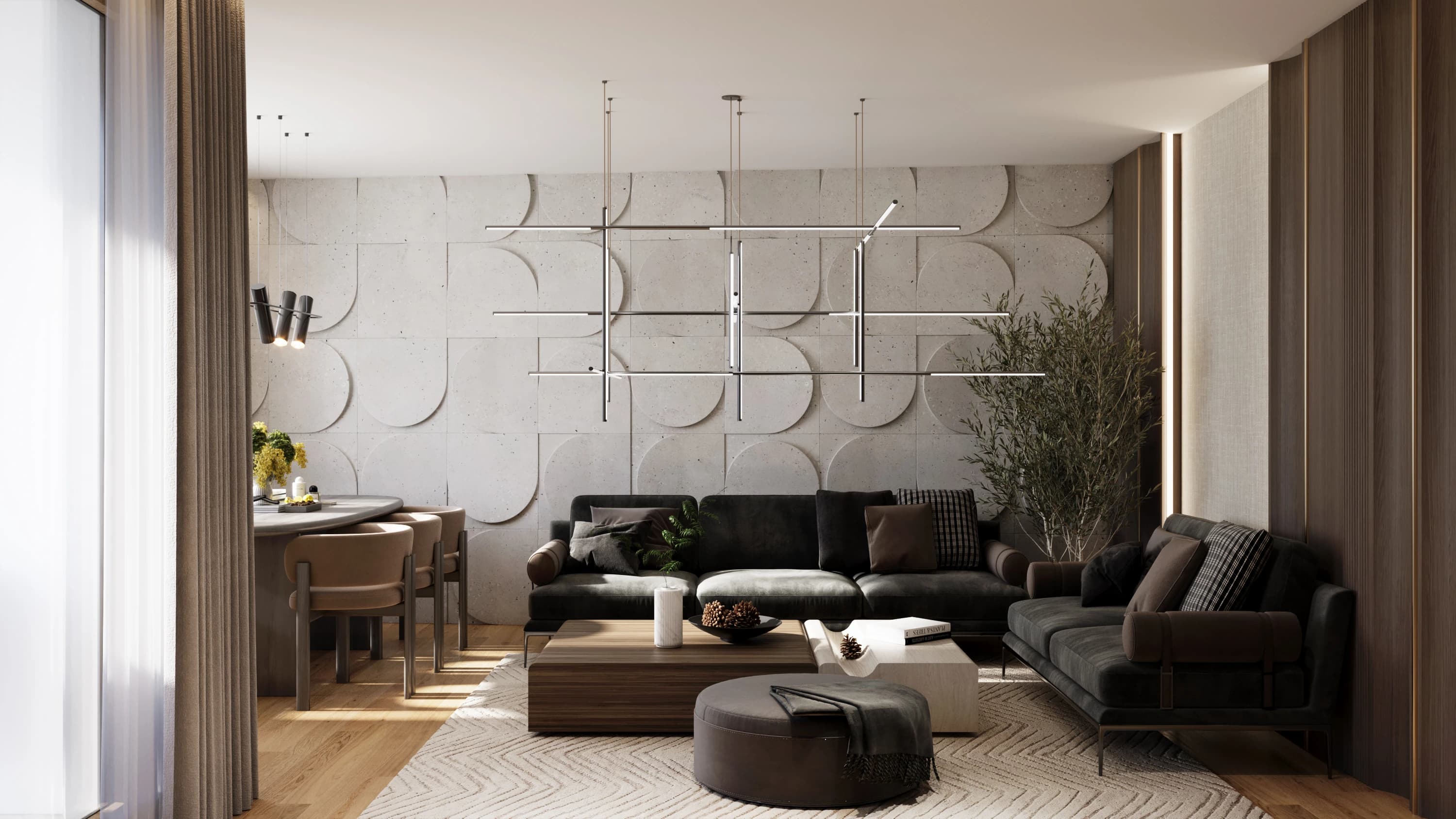 Living room of the Open plan apartment: sculpted concrete-look wall panels, charcoal sofas and a linear pendant light