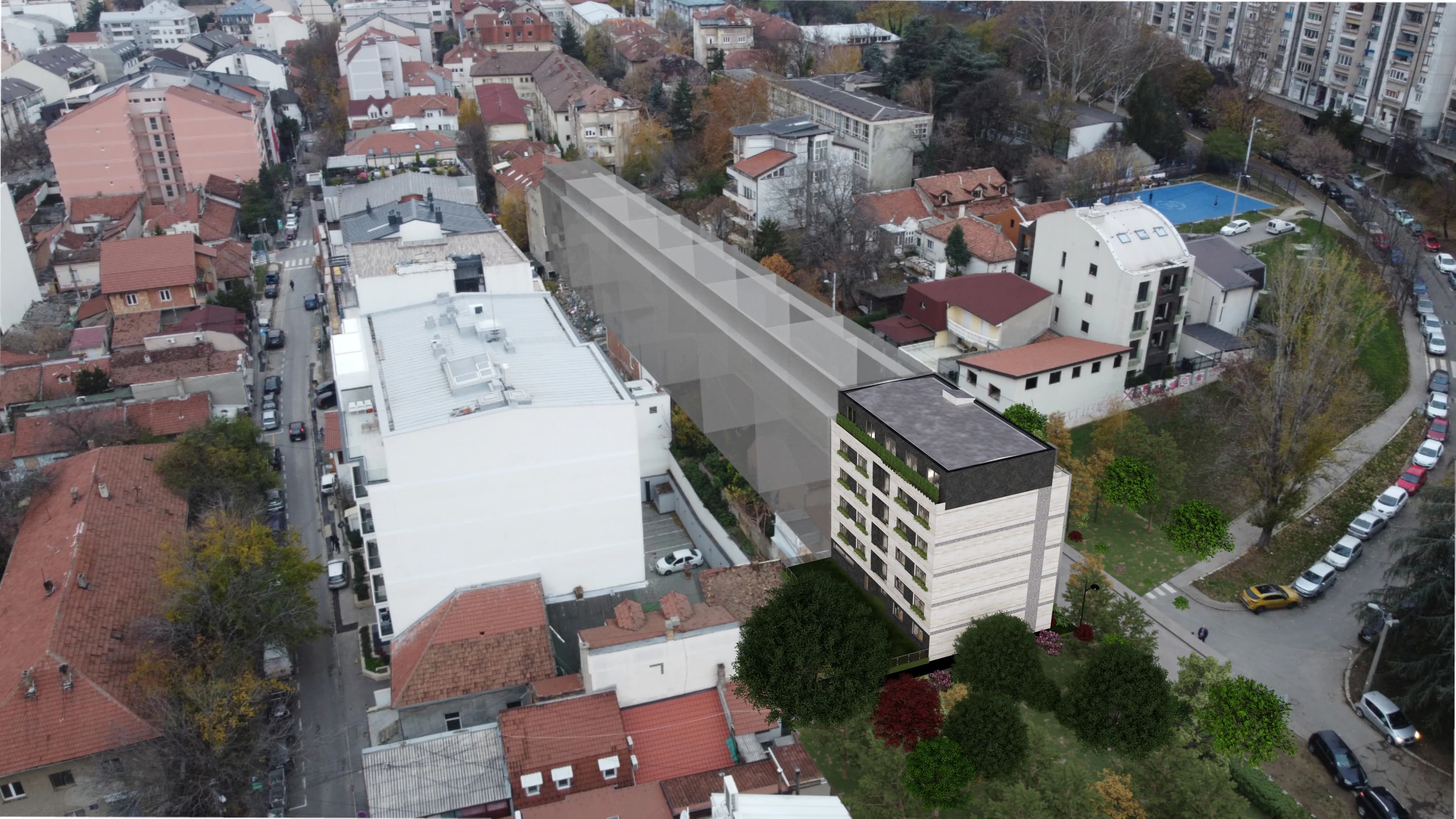 Photomontage of the design for a mixed-use building in Vračar, Belgrade, Serbia, set into a photograph of its site: aerial view from the park side of the block.