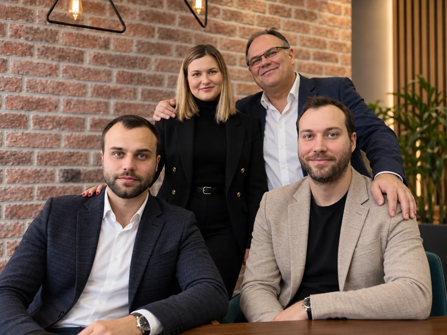 Boban Milivojević and his daughter Nađa standing behind his sons Jovan and Branko, who are seated