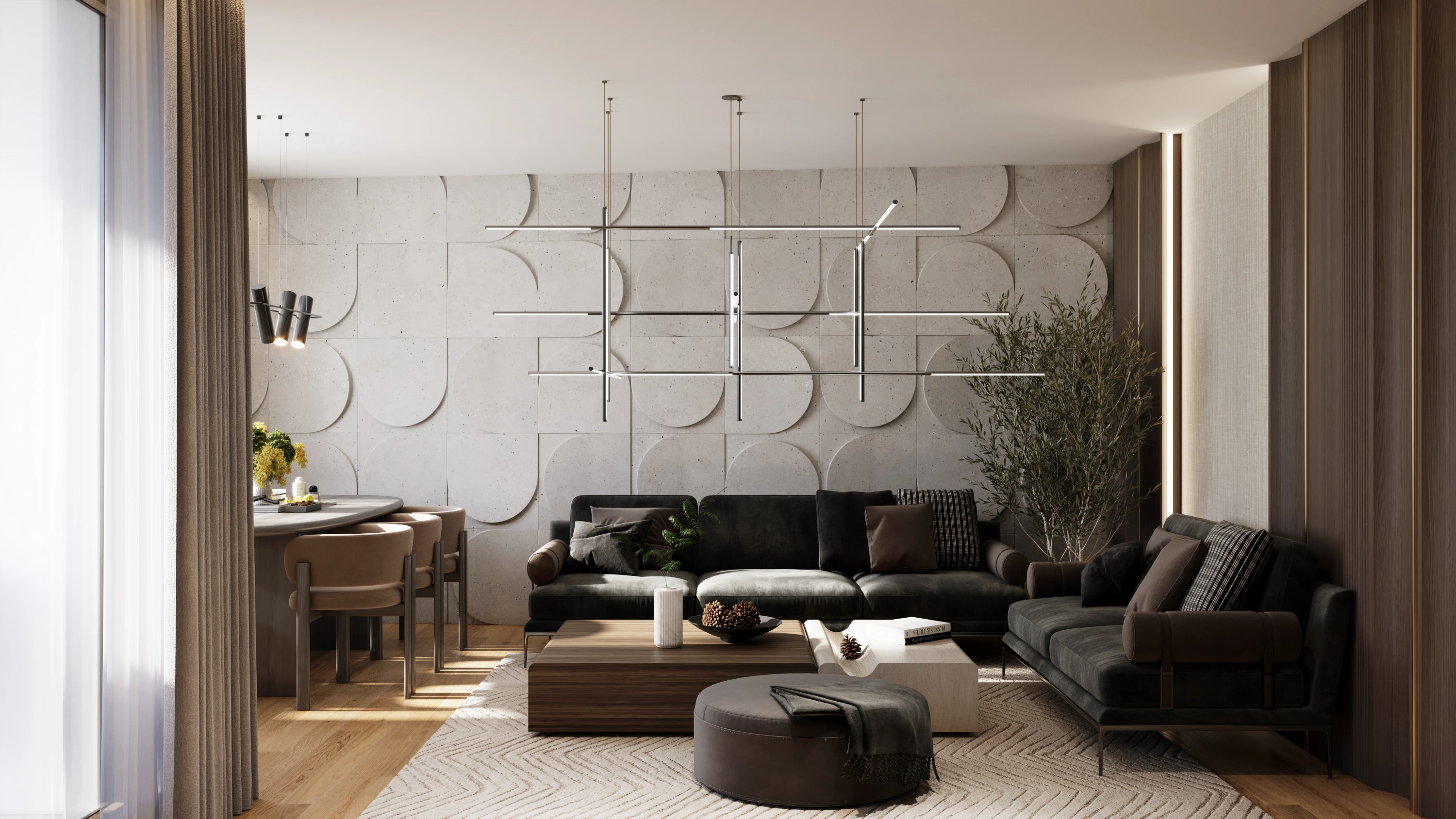 Living room of the Open plan apartment: sculpted concrete-look wall panels, charcoal sofas and a linear pendant light